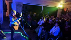 Emily with audience at house concert